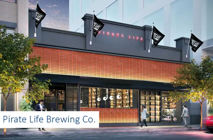 Pirate Life Brewing Co. storefront with modern design, large windows, and outdoor trees.