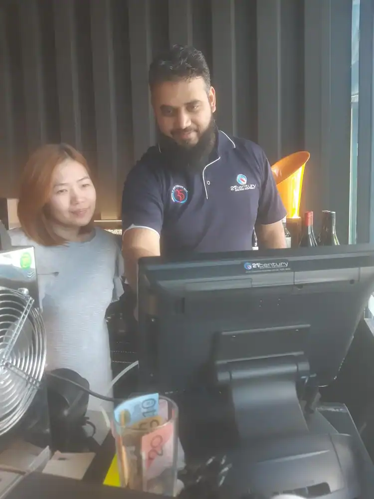 19. happy customers using advanced office equipment at 21st Century Business Equipment store in Australia.