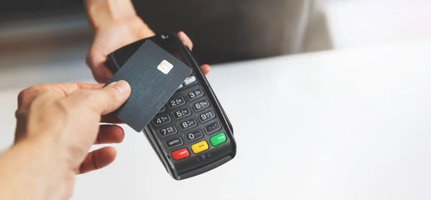 Contactless payment with card on a point of sale terminal for business transactions.