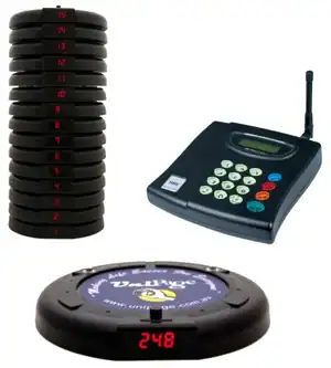 Stacked black digital storage disks, cash register scanner and wireless keypad.