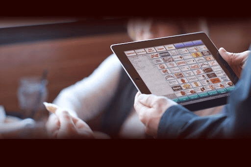 Tablet displaying a digital menu or app interface for business equipment management.