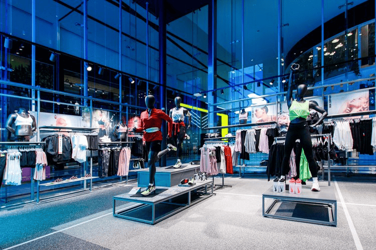 21st Century Business Equipment modern retail store with mannequins displaying athletic wear and apparel.