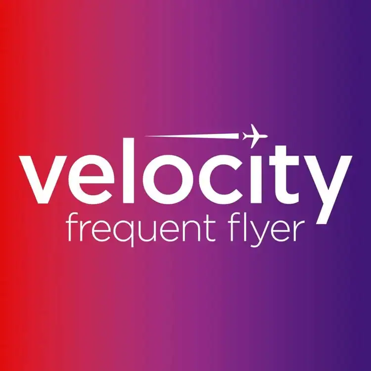 Velocity frequent flyer logo on a colorful gradient background, representing travel rewards, airline loyalty program.