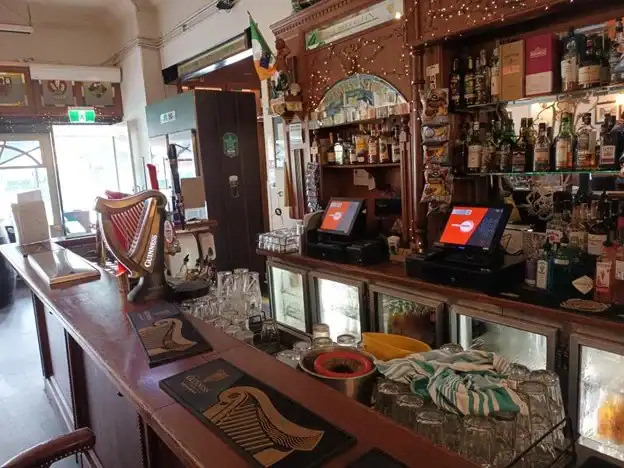 21st Century Business Equipment bar kiosk with modern POS systems inside a pub or bar.