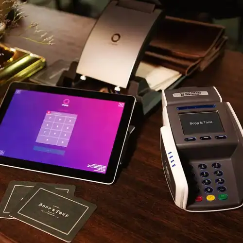 High-tech payment terminal and tablet for business transactions at 21st Century Business Equipment.