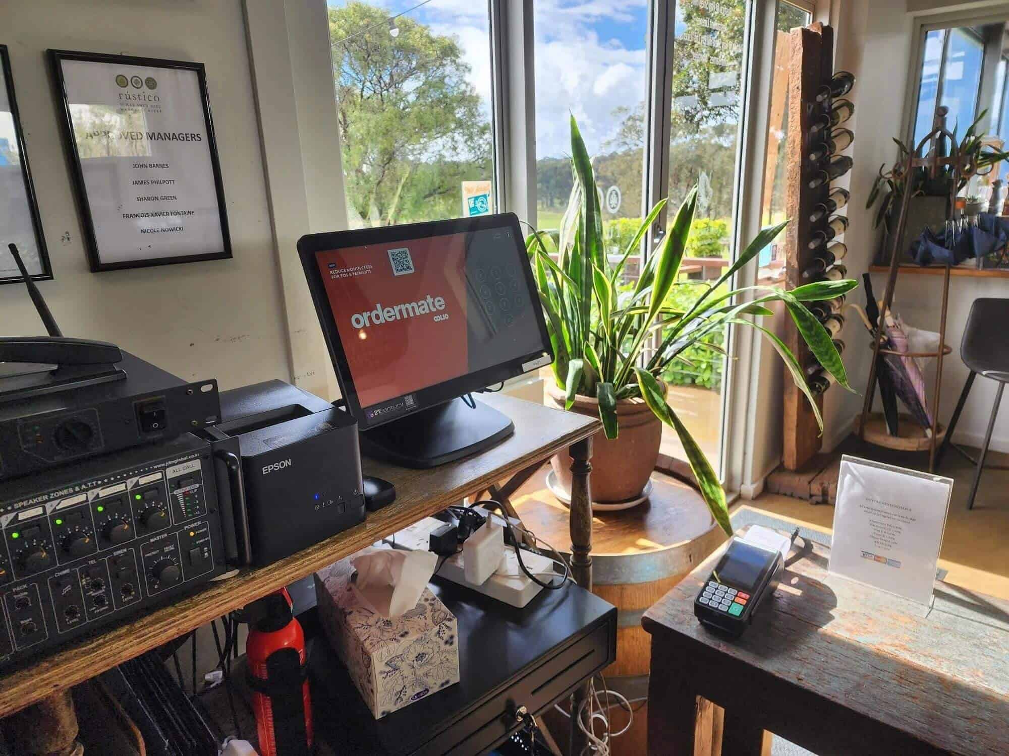 High-tech POS system with touchscreen monitor and payment terminal at 21st Century Business Equipment office.